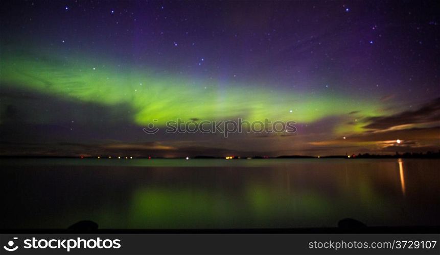 Northern Lights over the lake in Sweden