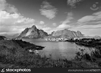 Norway village Reine on a fjord. Nordic sunny summer day. Lofoten Norway islands. Black and white