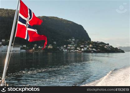 Norwegian flag on the edge of a boat, Bergen, Norway