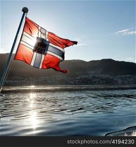 Norwegian flag on the edge of a boat, Norway