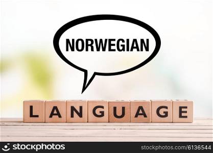 Norwegian language lesson sign made of cubes on a table