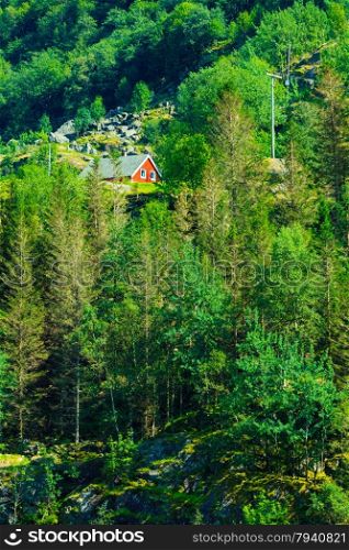 Norwegian red typical country house hytte in the mountains. Beautiful landscape in Norway, Scandinavia