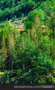 Norwegian red typical country house hytte in the mountains. Beautiful landscape in Norway, Scandinavia