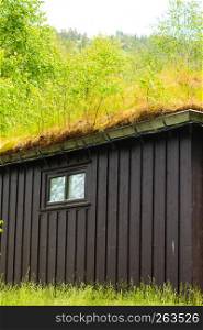 Norwegian typical country house with grass on the roof. Norwegian house with grass roof