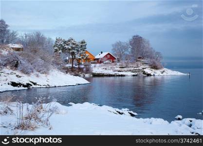 Norwegian winter fjord landscape with colorful houses