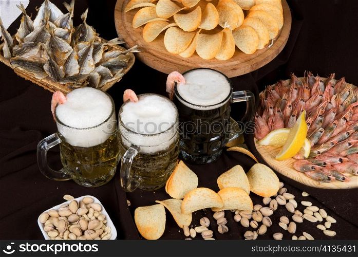 Nosh-up: beer sets and snacks on the restaurant table