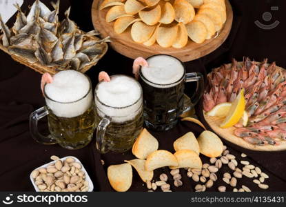 Nosh-up: beer sets and snacks on the restaurant table