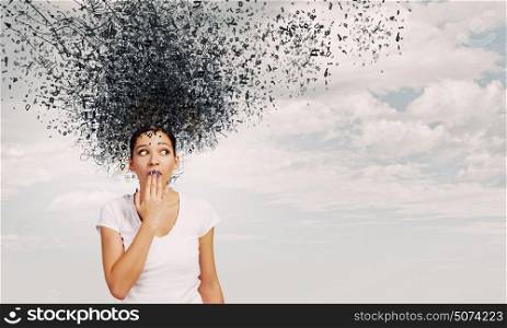 Not a word!. Young excited woman in casual closing mouth with palm