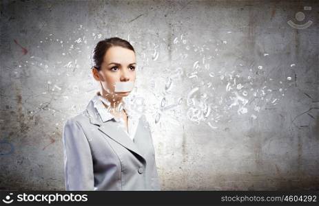 Not a word. Young speechless businesswoman with adhesive tape on mouth