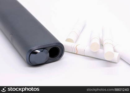 Not burning modern electronic cigarette heater with tobacco sticks on white background. Device of electronic cigarette for using tobacco sticks.