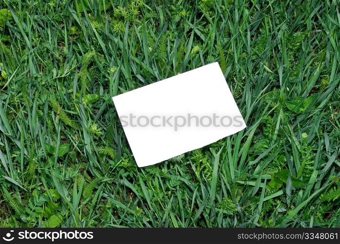Note blank on green grass