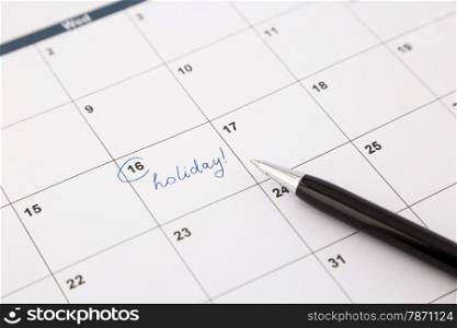 note date of holiday planning on calendar