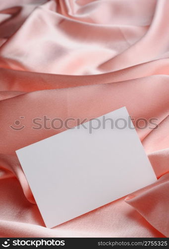Note on beige silk. The empty paper form