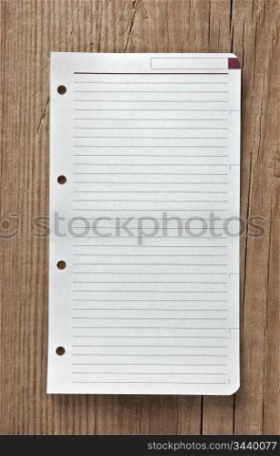 note on wooden background