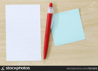 Note paper and red pen placed on wooden floor,Design ideas can be Entered your Message into the space as needed.