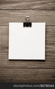 note paper on wood background