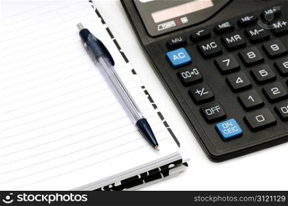 Notebook and calculator isolated on a white background