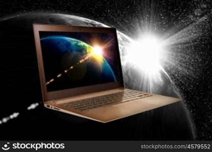Notebook and globe. Notebook with our planet earth against black background with globe