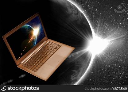 Notebook and globe. Notebook with our planet earth against black background with globe