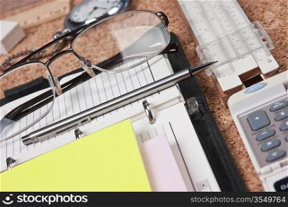 notebook and office supplies on the table