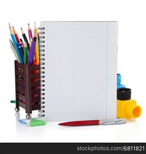 notebook and school supplies isolated on white background