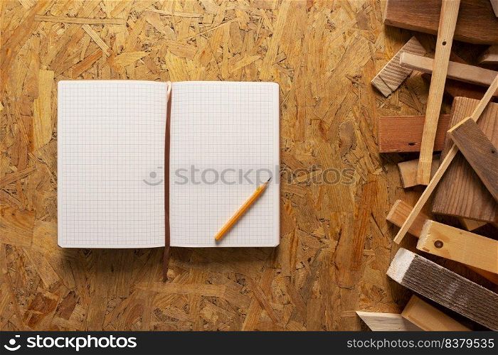 Notebook and wood at chipboard plywood background texture. Wooden plank bar