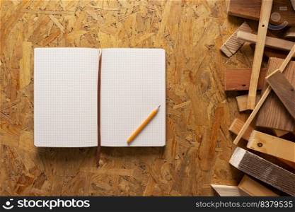 Notebook and wood at chipboard plywood background texture. Wooden plank bar