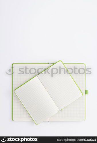 notebook at white paper background, top view