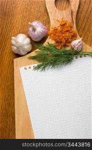 notebook for culinary recipes on a cutting board