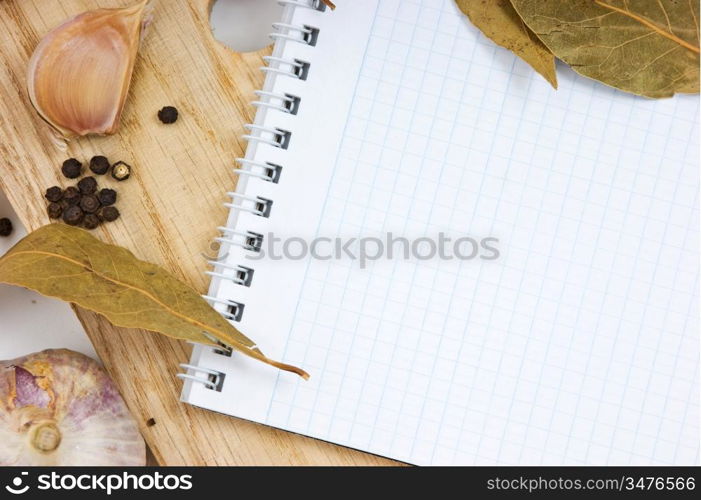 notebook for culinary recipes on a cutting board