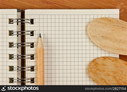 notebook for culinary recipes on a kitchen cutting board