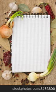 notebook for recipes and spices on an old wooden table