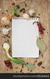 notebook for recipes and spices on an old wooden table