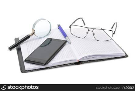 Notebook, glasses, cell phone and magnifying glass isolated on white