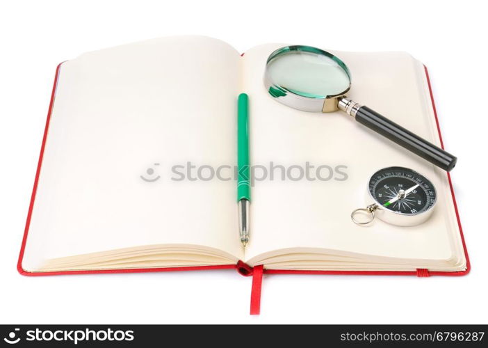 Notebook, magnifying glass and compass isolated on white background