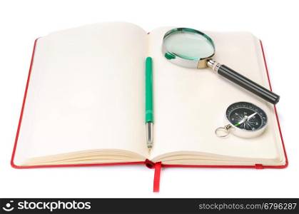 Notebook, magnifying glass and compass isolated on white background