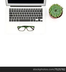 Notebook, succulent plant and glasses on white background. Office workplace. Flat lay
