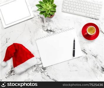 Notebook, tablet pc, Christmas decoration on working desk. Flat lay. Business holidays