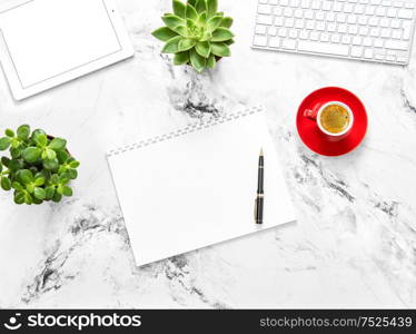 Notebook, tablet pc, coffee, succulent plants on marble background. Working desk. Flat lay