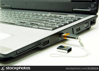 Notebook with a modem usb on white