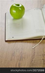 notebook with apple