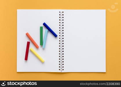 notebook with crayons