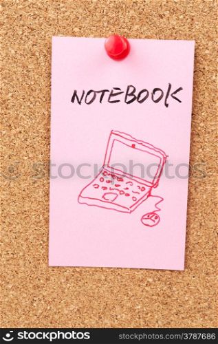 Notebook word and symbol drawn on paper and pinned on cork board