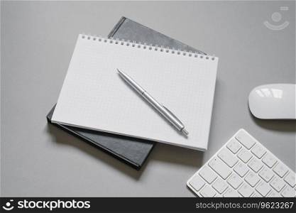 Notebooks or diaries with a blank page and a ballpoint pen on top of them. Office worker&rsquo;s place