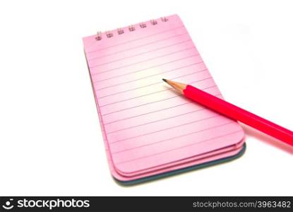notepad and pencil close-up on white background