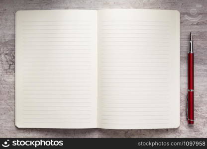 notepad or notebook paper at stone background surface table, top view