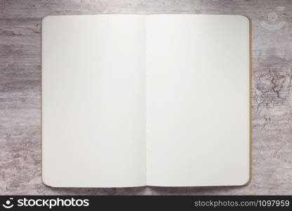 notepad or notebook paper at stone background surface table, top view