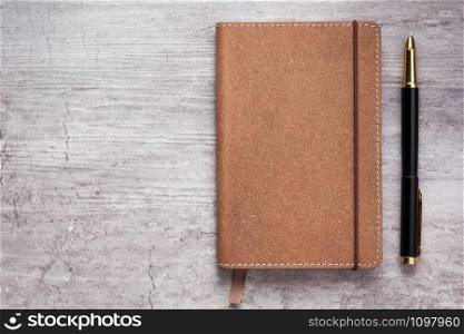 notepad or notebook paper at stone background surface table, top view