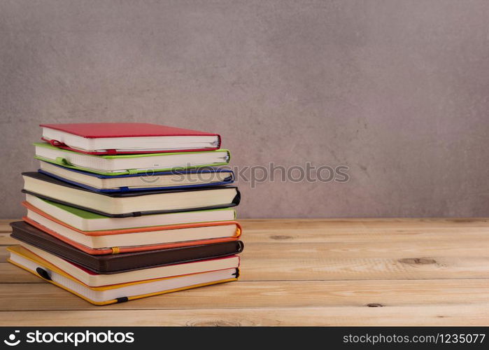 notepad or paper notebook at wooden table background surface table