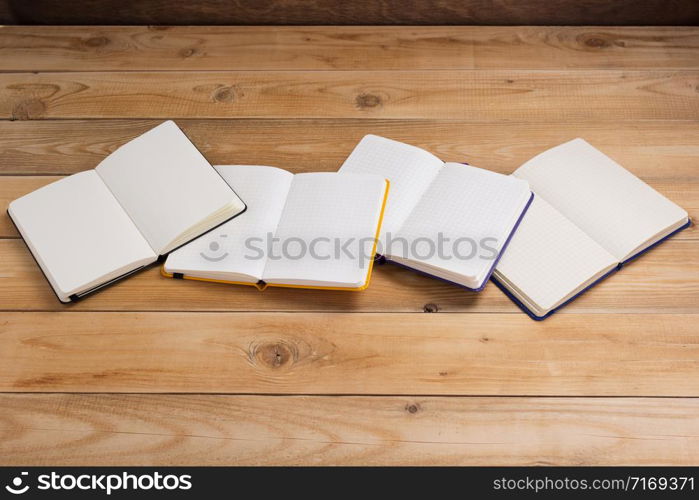 notepad or paper notebook at wooden table background surface table